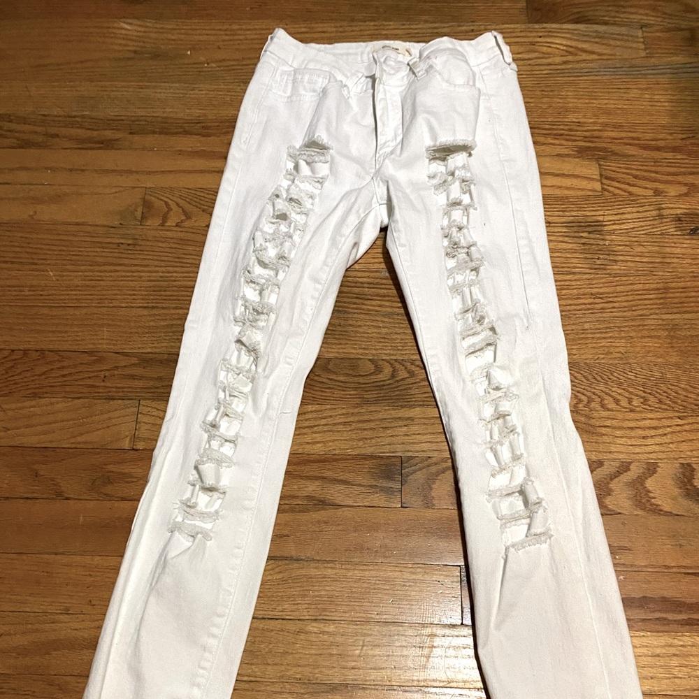 White skinny jeans rips down both legs size7